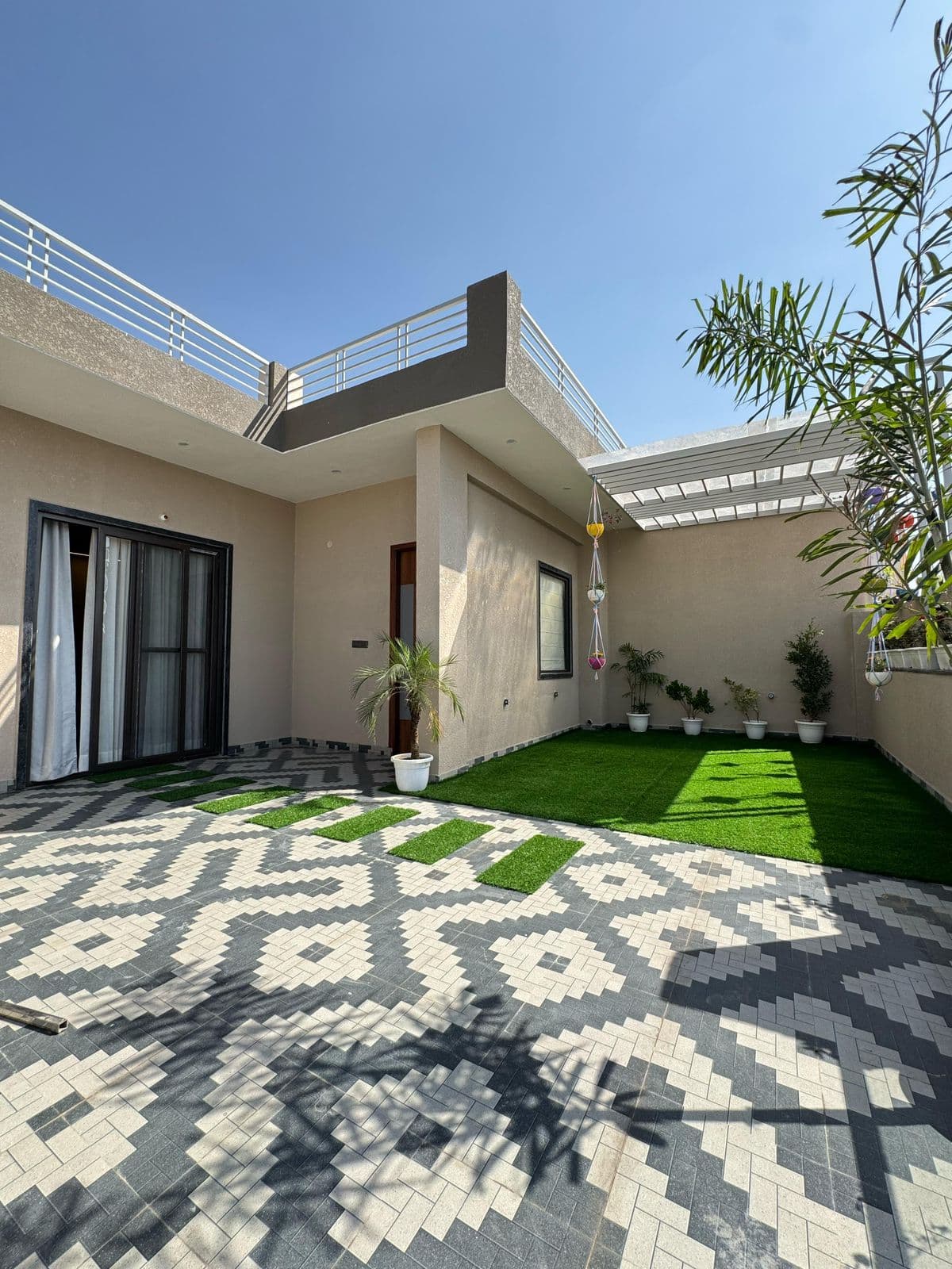Courtyard with designer tiles & garden area