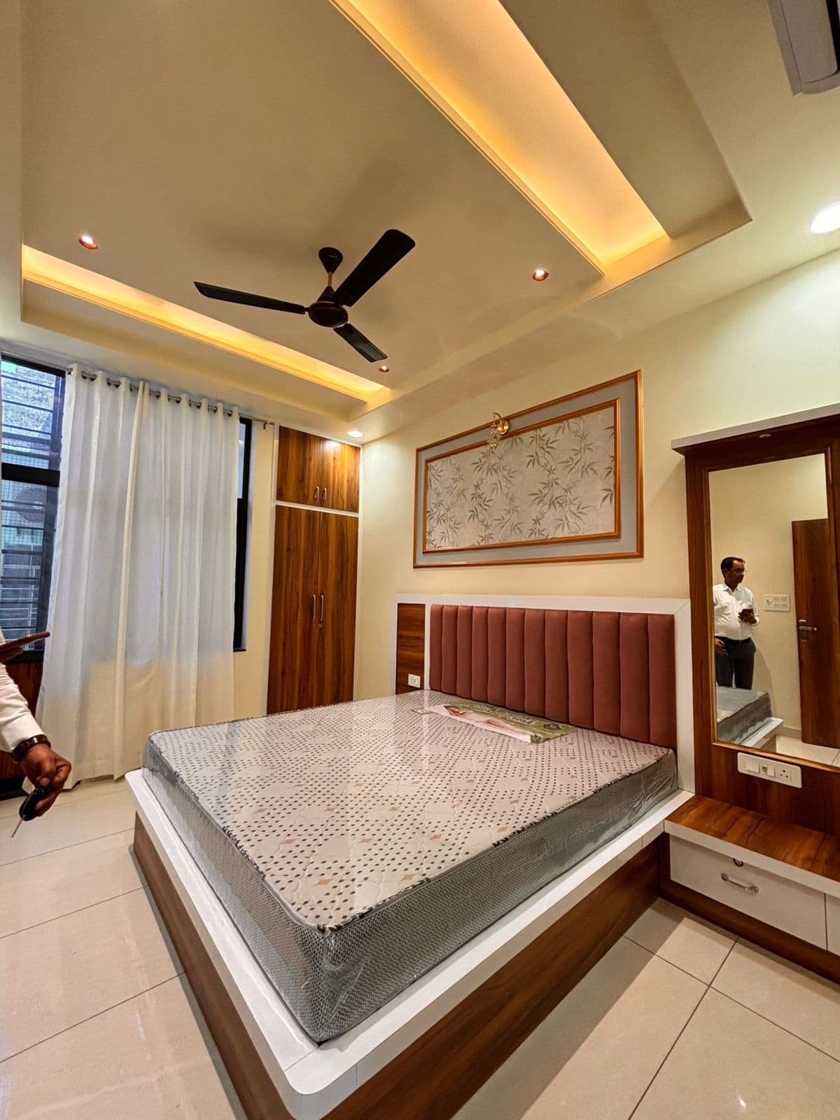 Bedroom with velvet headboard & dressing area