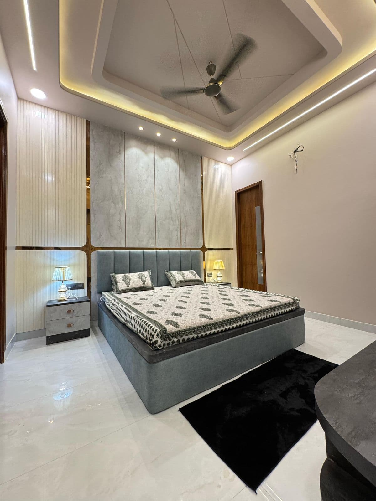 Bedroom with designer wall paneling