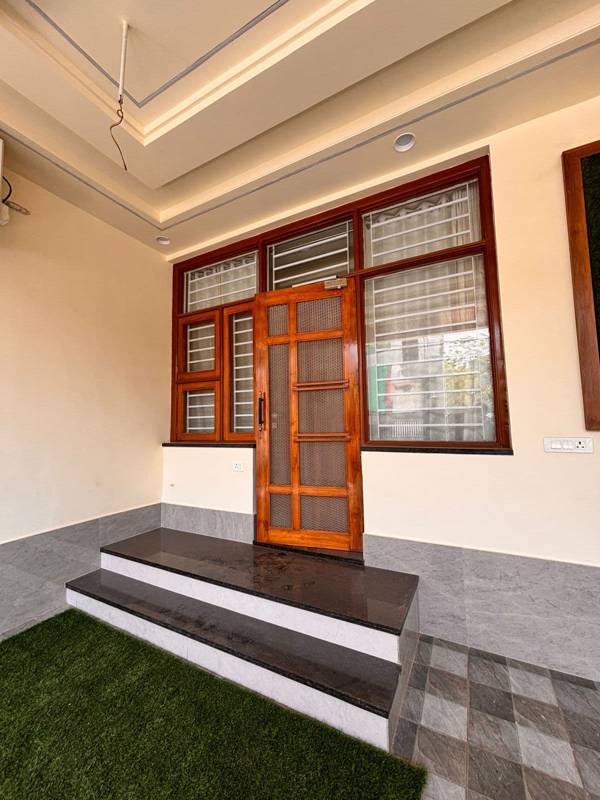 Bedroom with upholstered headboard & dressing mirror